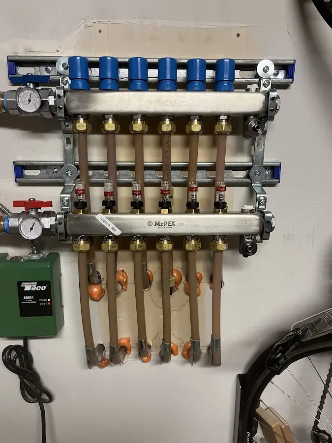 Plumber performing Water Heater Repair at a residential property in Bosque Farms